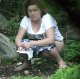A plump, Eastern-European woman is voyeuristically recorded taking a piss in an outdoor location that appears to common dumping area for others. Presented in 720P HD. Over a minute.